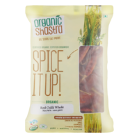 "Packaging of Organic Shastra Red Chilli Whole, 100 grams, featuring a clear window showing the chillies inside, with labels indicating it is certified organic and free from synthetic pesticides, GMOs, and other chemicals."