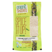 Organic Shastra Sesame White Natural 100 gm package with green and yellow design, featuring 'Spice It Up! Organic Sesame White Natural' text, and certifications for being organic, free from synthetic pesticides, GMOs, chemicals, and synthetic hormones